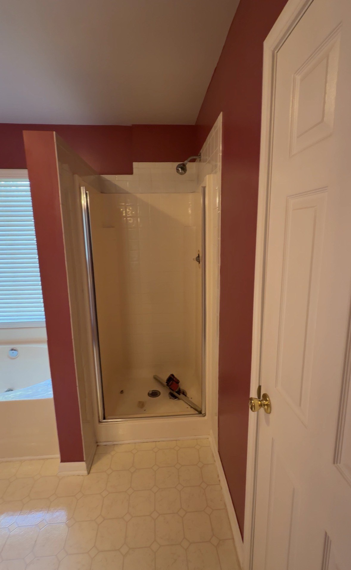 Original shower enclosure before conversion to storage